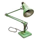 A vintage Anglepoise desk lamp, painted in green, designed by Herbert Terry.