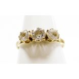 A 9ct gold and cubic zirconia set dress ring, the three czs in a raised claw setting, with pierced