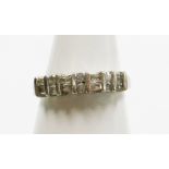 A diamond half hoop eternity ring, set with arrangement of six round brilliant cut diamonds and