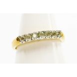 A dress ring, half hoop set with cz stones, on yellow metal band, unmarked, ring size P½, 2.5g all