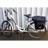 An A Powered Bicycle Free Spirit low step electric bicycle, with keys and cover.