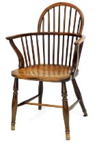 A 19thC yew and elm Windsor chair, with spindle turned back, solid seat, on turned legs with H