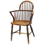 A 19thC yew and elm Windsor chair, with spindle turned back, solid seat, on turned legs with H