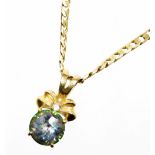 A pendant and chain, the mystic and white topaz 9ct gold pendant with makers stamp DK, formed as a