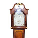 George Atkinson, Louth. A 19thC oak and mahogany longcase clock, the arched dial painted with a