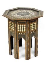 An early 20thC Anglo Indian hardwood occasional table, the octagonal top inlaid in mother of pearl