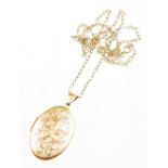 A 9ct gold locket pendant and chain, the oval floral embossed pendant opening to reveal a double