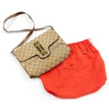 A vintage Gucci Ophidia shoulder bag, with GG monogrammed fabric, brown leather trim and handles,