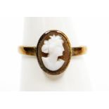 A 9ct gold cameo dress ring, oval cameo depicting bust portrait of a classical lady, in rub over