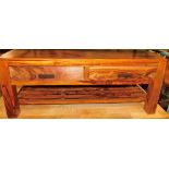 A hardwood coffee table, with two frieze drawers and a slatted under tier, 45cm high, the top