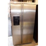 A Maytag American style fridge freezer, with ice dispenser.