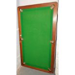 A table top snooker table, with a green baize top. Lots 1501 to 1580 are available to view and