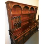 An oak Old Charm dresser, 182cm high, 188cm wide, 44cm deep.