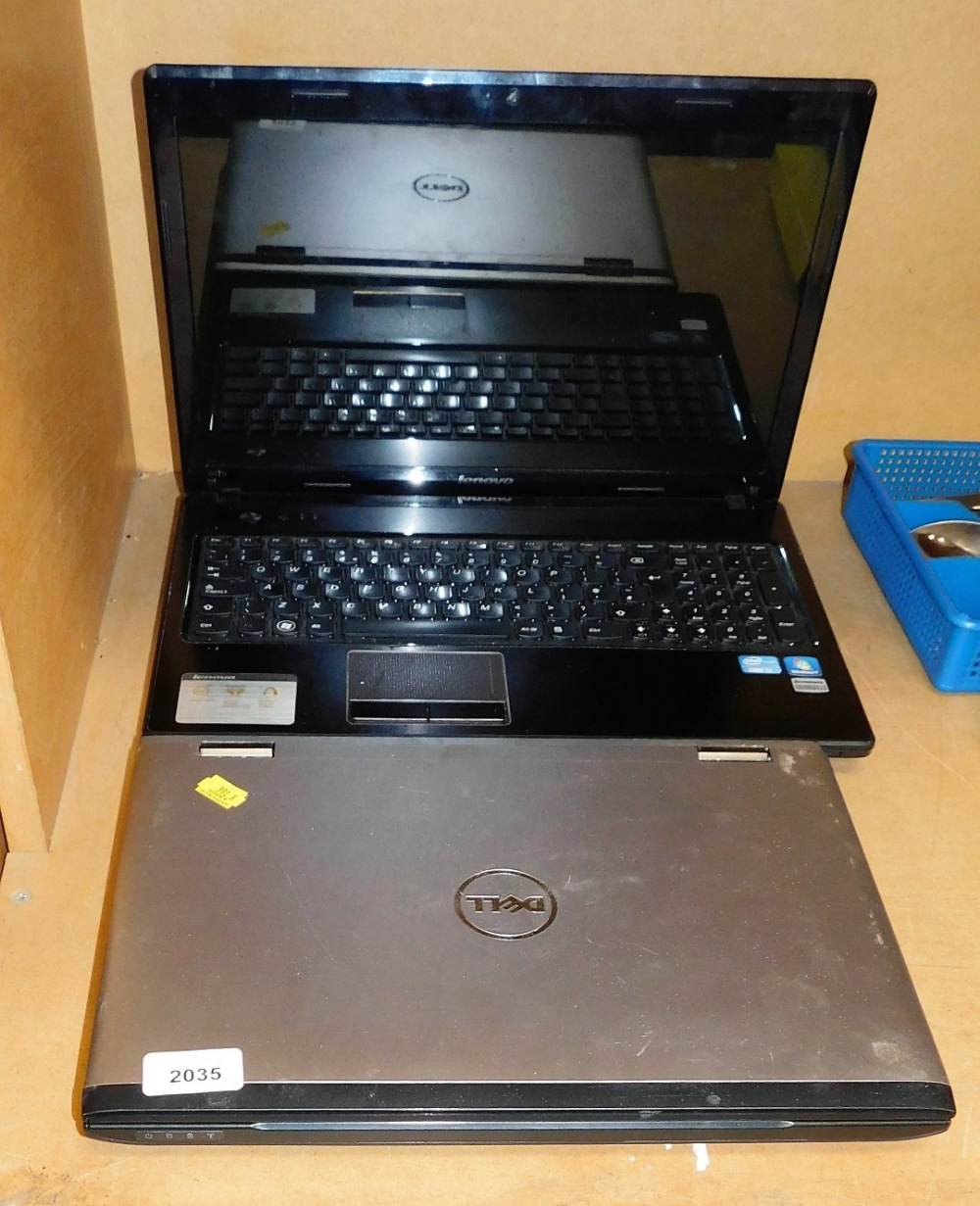 A Dell Vostro laptop, and a Lenovo laptop. (2)