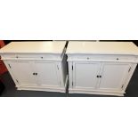 A pair of white painted sideboards, 81cm high, 98cm wide, 42cm deep.