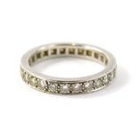 An 18ct white gold diamond eternity ring, set with around twenty eight round brilliant cut diamonds,