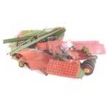 Various vintage Meccano, to include cog wheel, 15cm diameter, various other bits, mainly in red and