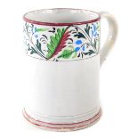 An early 19thC Scottish pottery pearlware frog mug, with strapware handle and upper floral banding,