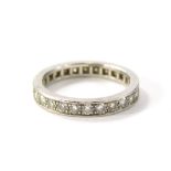 An 18ct white gold diamond eternity ring, set with around twenty eight round brilliant cut stones in