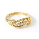 An 18ct gold dress ring, inset with tiny diamonds, 2.4g all in, size M.