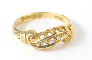An 18ct gold dress ring, inset with tiny diamonds, 2.4g all in, size M.