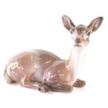 A Dahl Jensen Copenhagen figure of a recumbent doe, 1147, printed marks beneath, 15cm high.