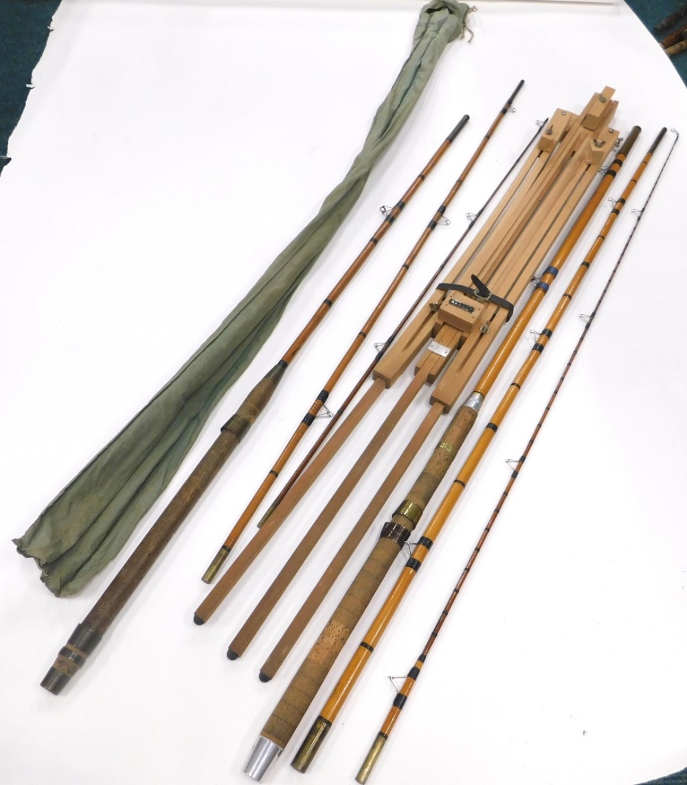 Various split fly fishing rods, early 20thC and a modern beech Reeves easel, 112cm high.