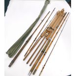 Various split fly fishing rods, early 20thC and a modern beech Reeves easel, 112cm high.
