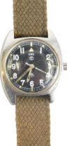 A 1970s CWC military issue wristwatch, with shaped case, luminous hands and markers, chrome case and