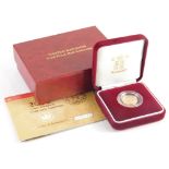 An Elizabeth II gold proof half sovereign, 2002, in outer case with paperwork.