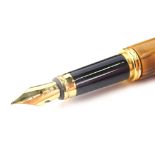 A fountain pen, with turned wooden body and lid, gilt coloured clip and nib marked Aridum Point, 14c