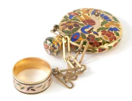 A 20thC enamel pendant scent bottle, with ring top and chain hanger, the circular body with compress