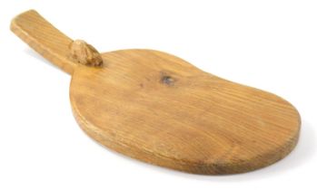 A Peter Heap of Wetwang Rabbitman oak cheese board, with carved rabbit, shaped body and plain handle