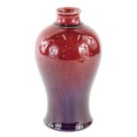 An early 20thC Bernard Moore flambe vase, of inverted shouldered circular form, predominantly in red