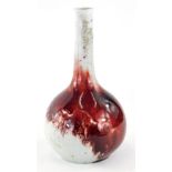 An early 20thC Bernard Moore Studio pottery bottle shaped vase, predominantly in red and cream, on c