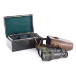 A pair of early 20thC marine binoculars, of turned cylindrical form, marked to the central bridge, 1