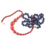 A lapis lazuli style necklace, set with uniform beads, 72cm long, with a graduated faux red amber ne