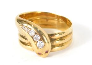An 18ct gold serpent dress ring, inset with tiny diamonds and rubies, 9.8g all in, size U.