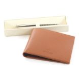 A Rolex ballpoint pen, 13cm long and a Rolex wallet, each cased. (2)