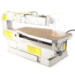 A Wickes 16'' scroll saw, 54cm wide.