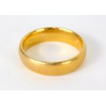 A 22ct gold wedding band, 6.4g, size L-M.