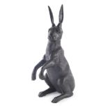 A modern bronzed standing figure of a hare, of large proportion, unsigned, 48cm high.