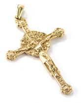 A 9ct gold crucifix pendant, with shaped hook top with detailed decoration, 9cm high, 22g.