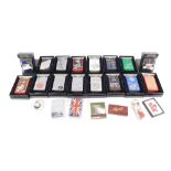A collection of Zippo lighters, mainly boxed, each with applied decoration. (1 tray)