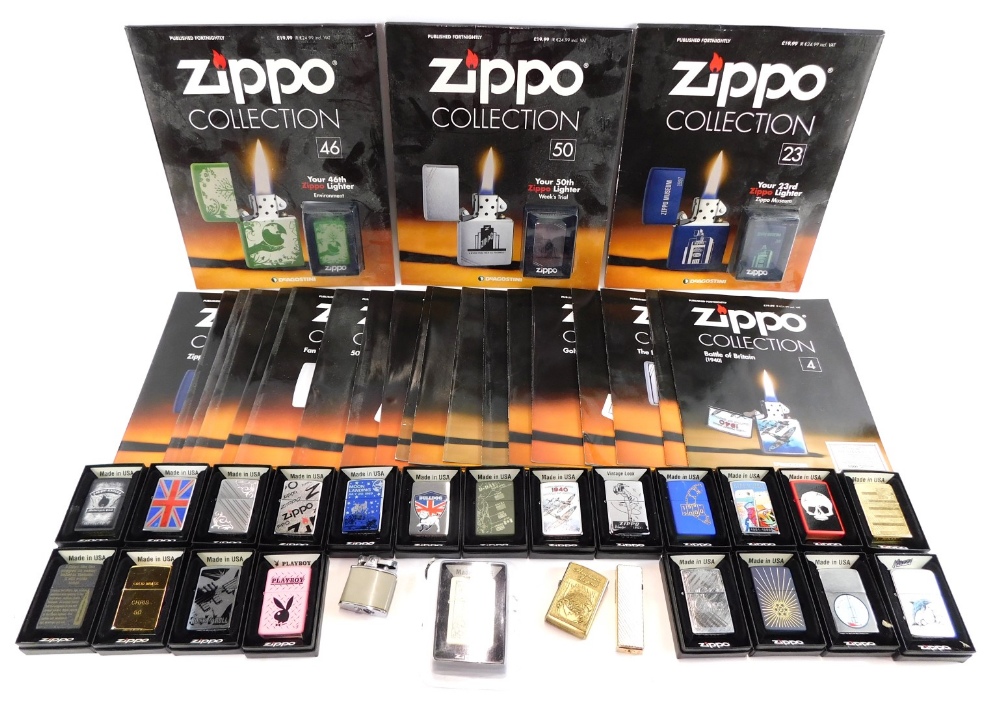 A collection of Zippo lighters, mainly boxed, each with applied decoration, and a collection of Zipp