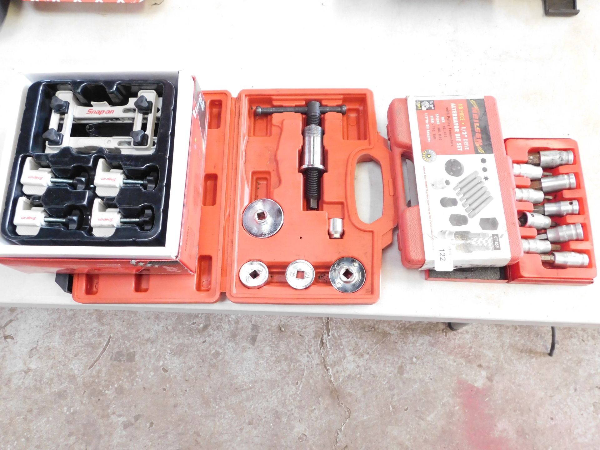 A Snap On gear lock master kit, a Neilsen break caliper piston tool, a Neilsen alternator bit set, a