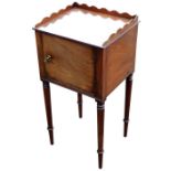 A George IV mahogany pot cupboard, with a three sided gallery top, over a single door, raised on rin