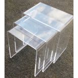 A late 20thC Perspex nest of occasional tables, largest table 45cm high, 45cm wide.