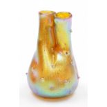A Loetz style gold iridescent glass vase, of dimpled conjoined form, 13.5cm high.