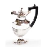 An Edward VII silver hot water jug, the hinged lid with a scroll cast finial, ebonised angular handl